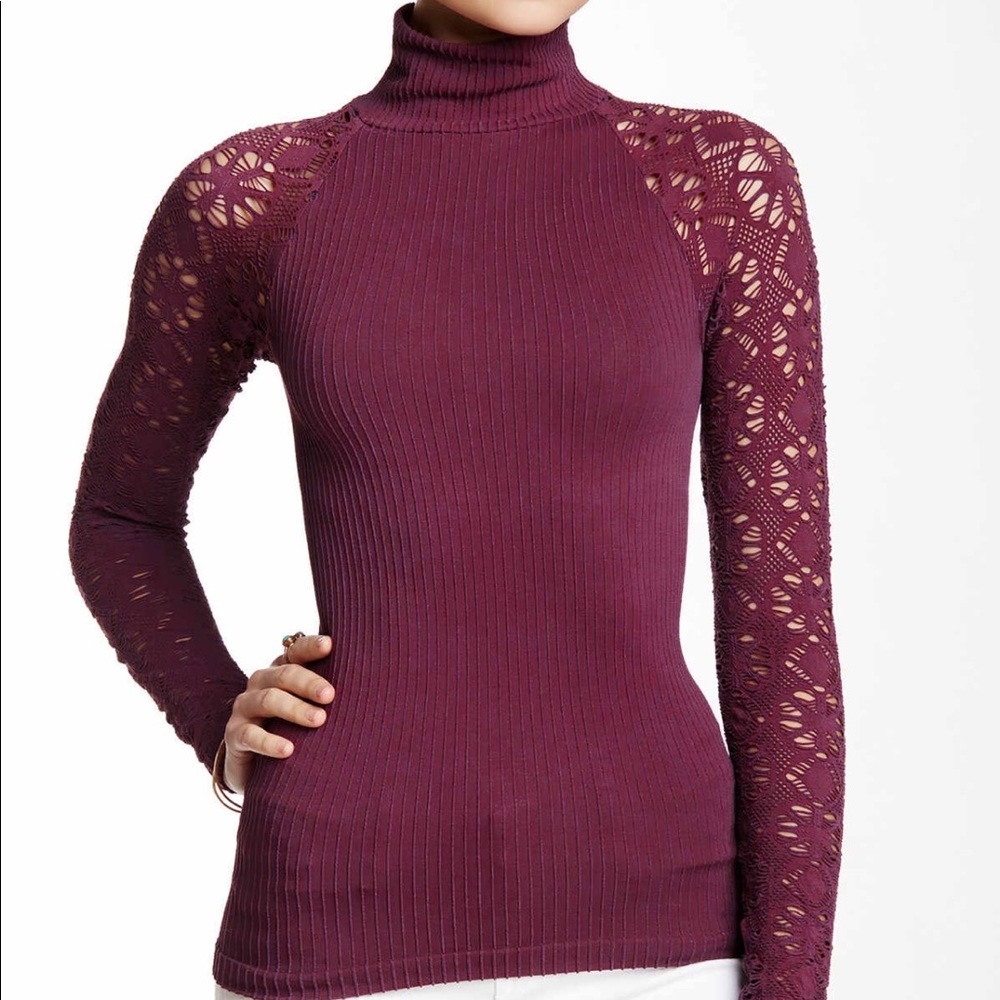 New Free People top with lace arms. Form fitting.